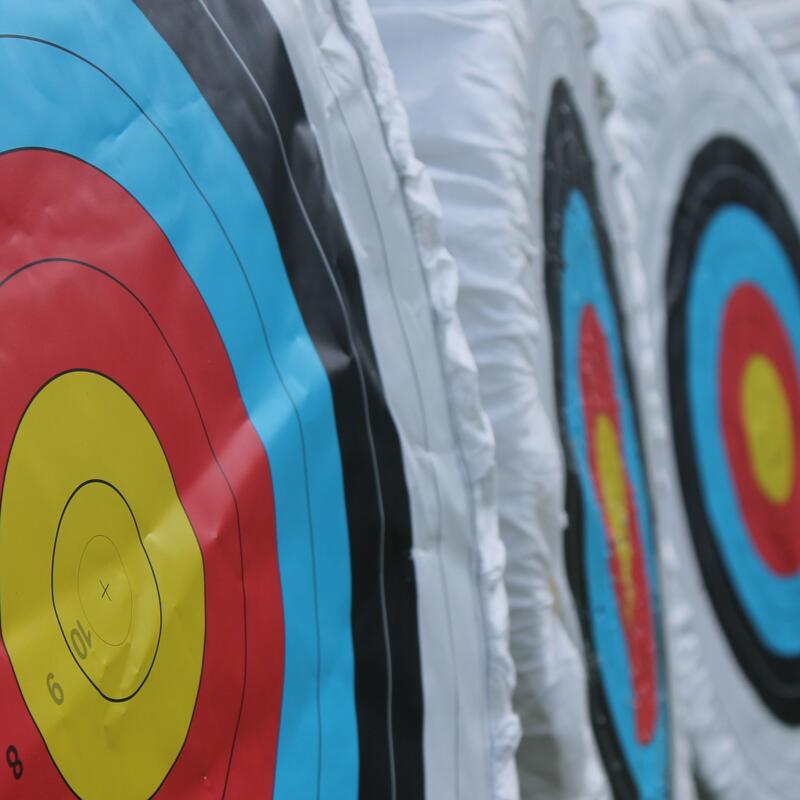 Archery targets with yellow, red, and blue bullseyes